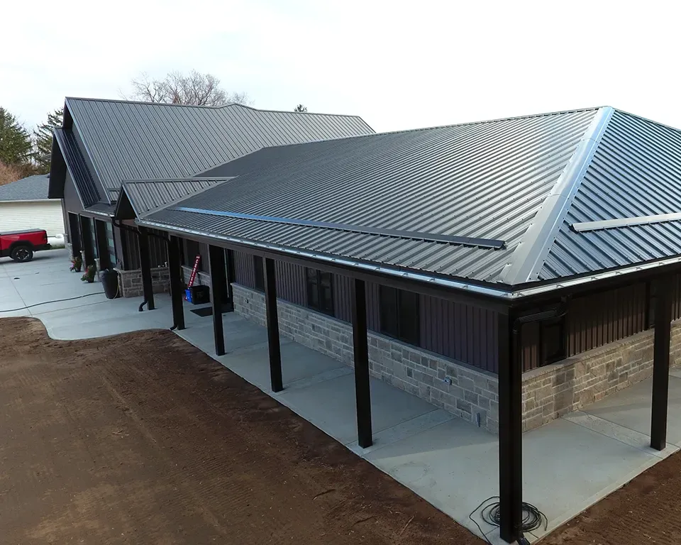 A picture of a house with a metal roof