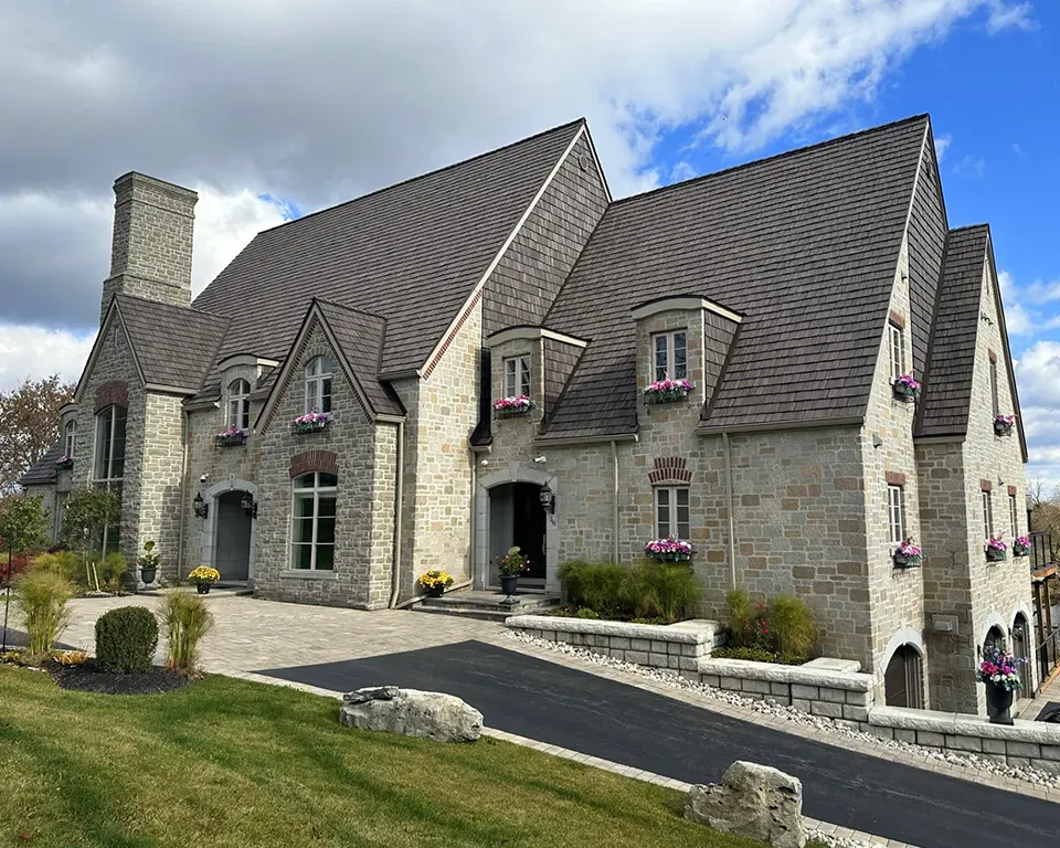 A picture of a house with a synthetic roof